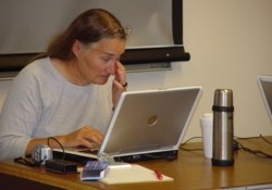 Instructor focusing on laptop screen