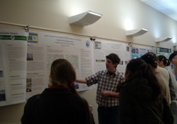 Student presenting a poster