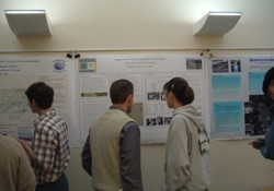 Two students studying a poster