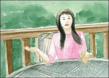 Girl sitting at a table talking
