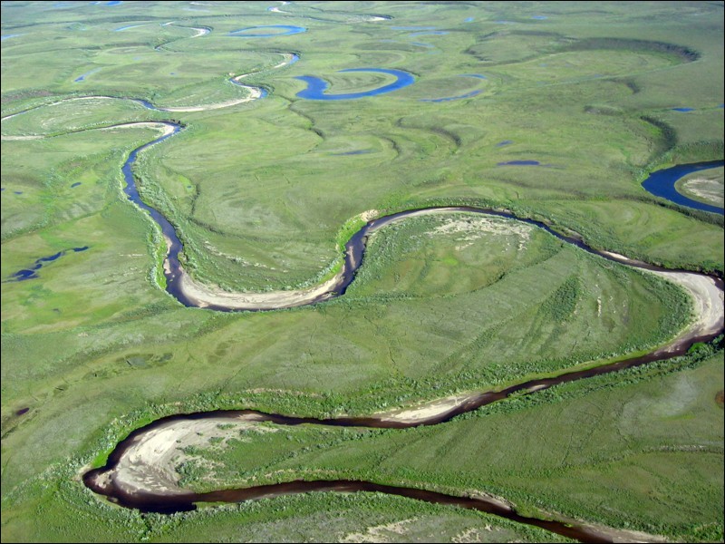 Photograph of a meandering river with sand banks